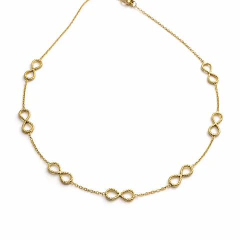 collar Infinia dorado con símbolos infinito sobre fondo blanco