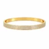 Pulsera Lumi de acero inoxidable dorado con circonitas en muñeca – Inaya Complementos